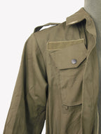 Close up of Italian military surplus jacket showing shoulder epaulette, Velcro patch, and buttoned chest pocket