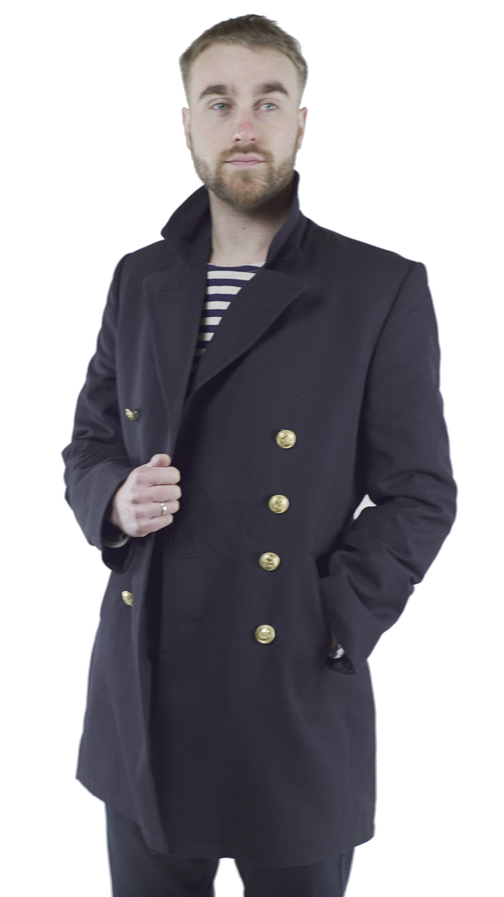 A model wearing a black German Navy peacoat over a striped shirt, highlighting the collar and double-breasted gold button design.