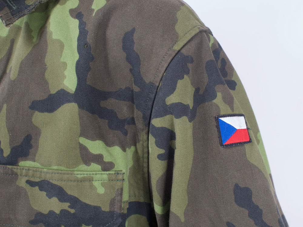 Close-up of the left sleeve on a Czech Army M95 parka displaying the embroidered Czech flag patch on the shoulder.