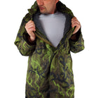 Model demonstrating the modular thermal system by partially opening the M95 parka to show the interior gray lining.