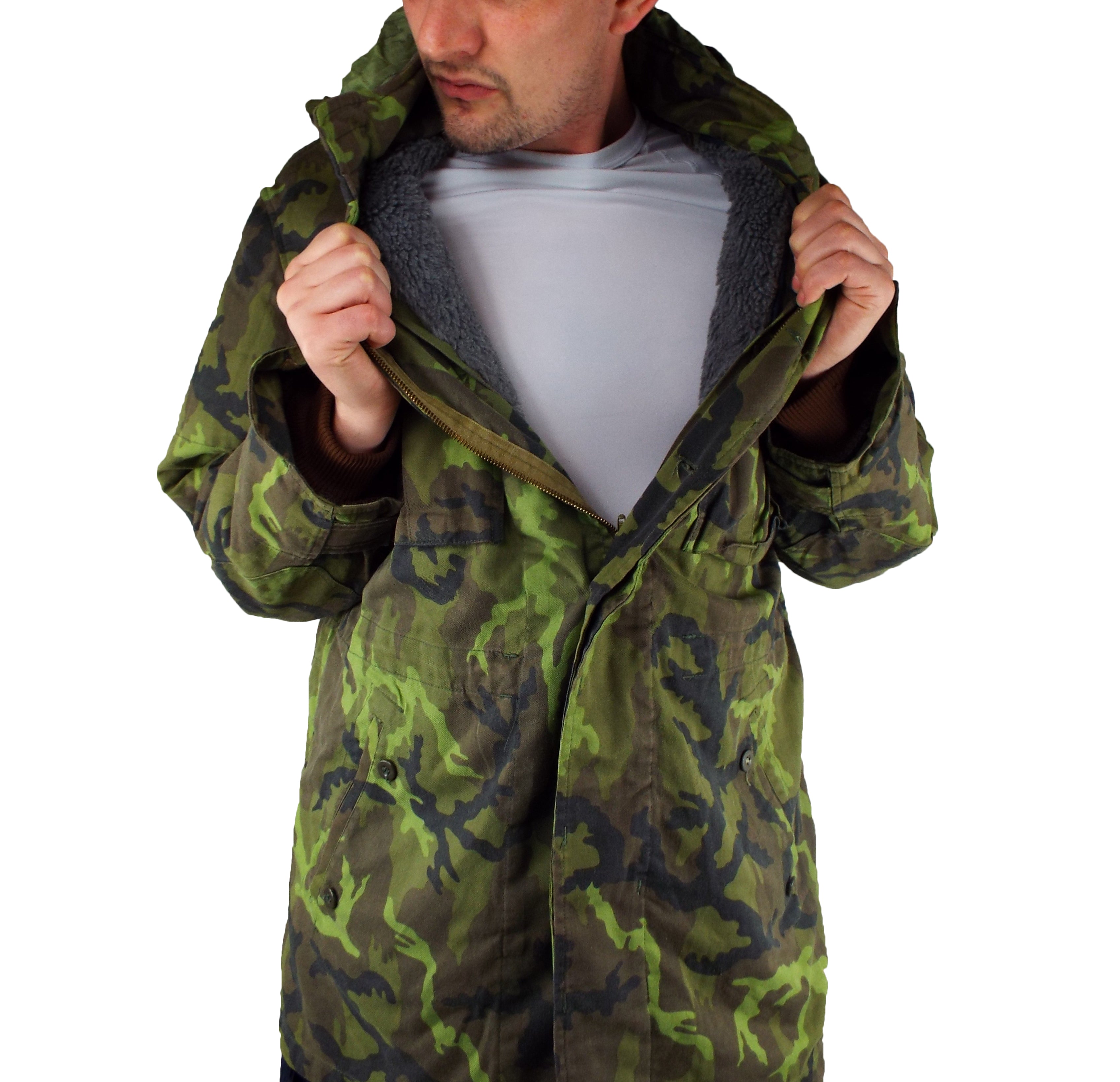 Model demonstrating the modular thermal system by partially opening the M95 parka to show the interior gray lining.