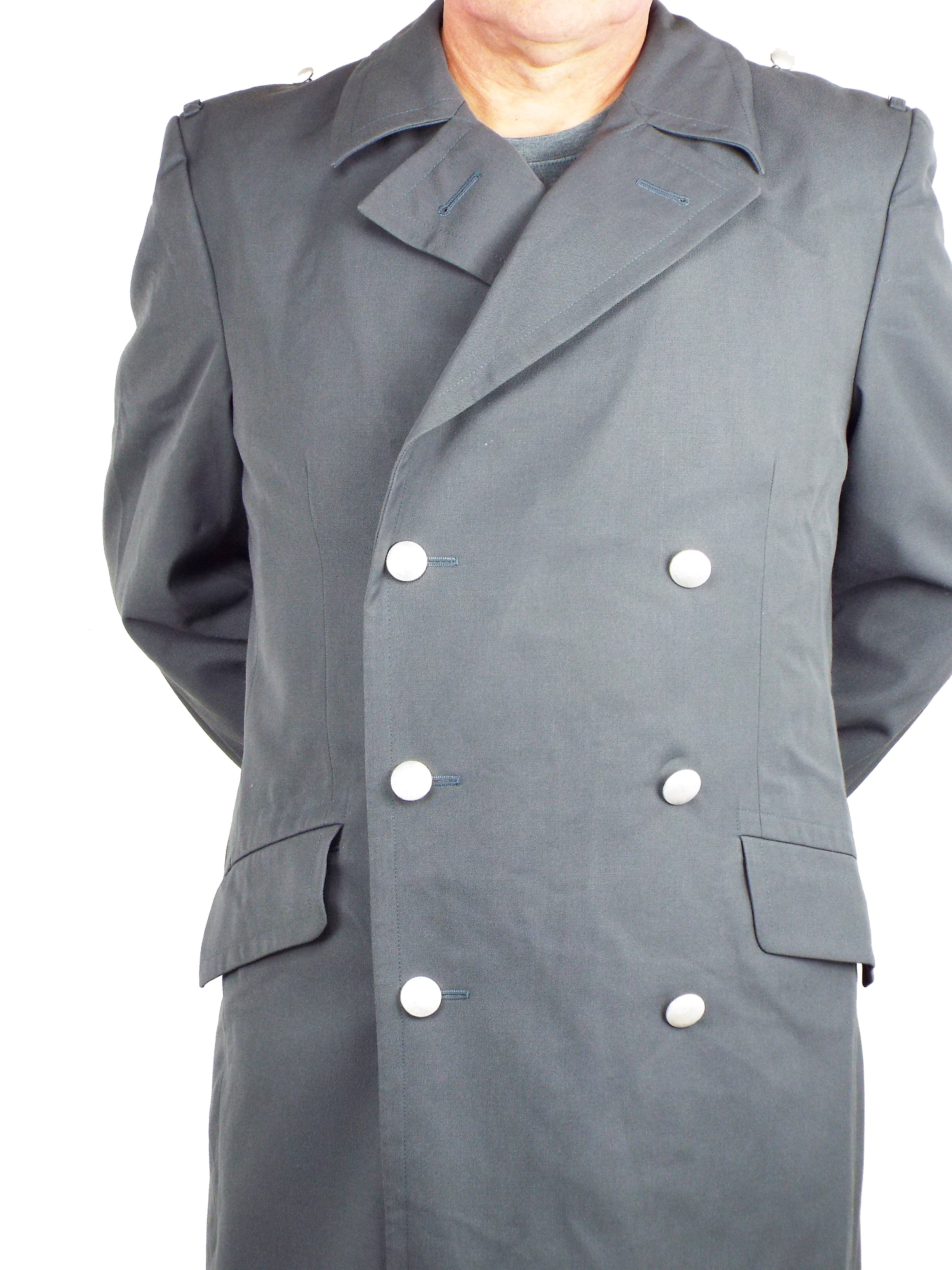 Close-up of a German grey military trench coat featuring silver stippled buttons and a traditional double-breasted collar.