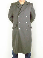 Full-length German army surplus grey men's military trench coat, showing the classic double-breasted gabardine design.