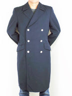Front view of a dark blue German Navy trench coat in Grade 1 gabardine fabric, featuring a double-breasted design and silver stippled buttons.