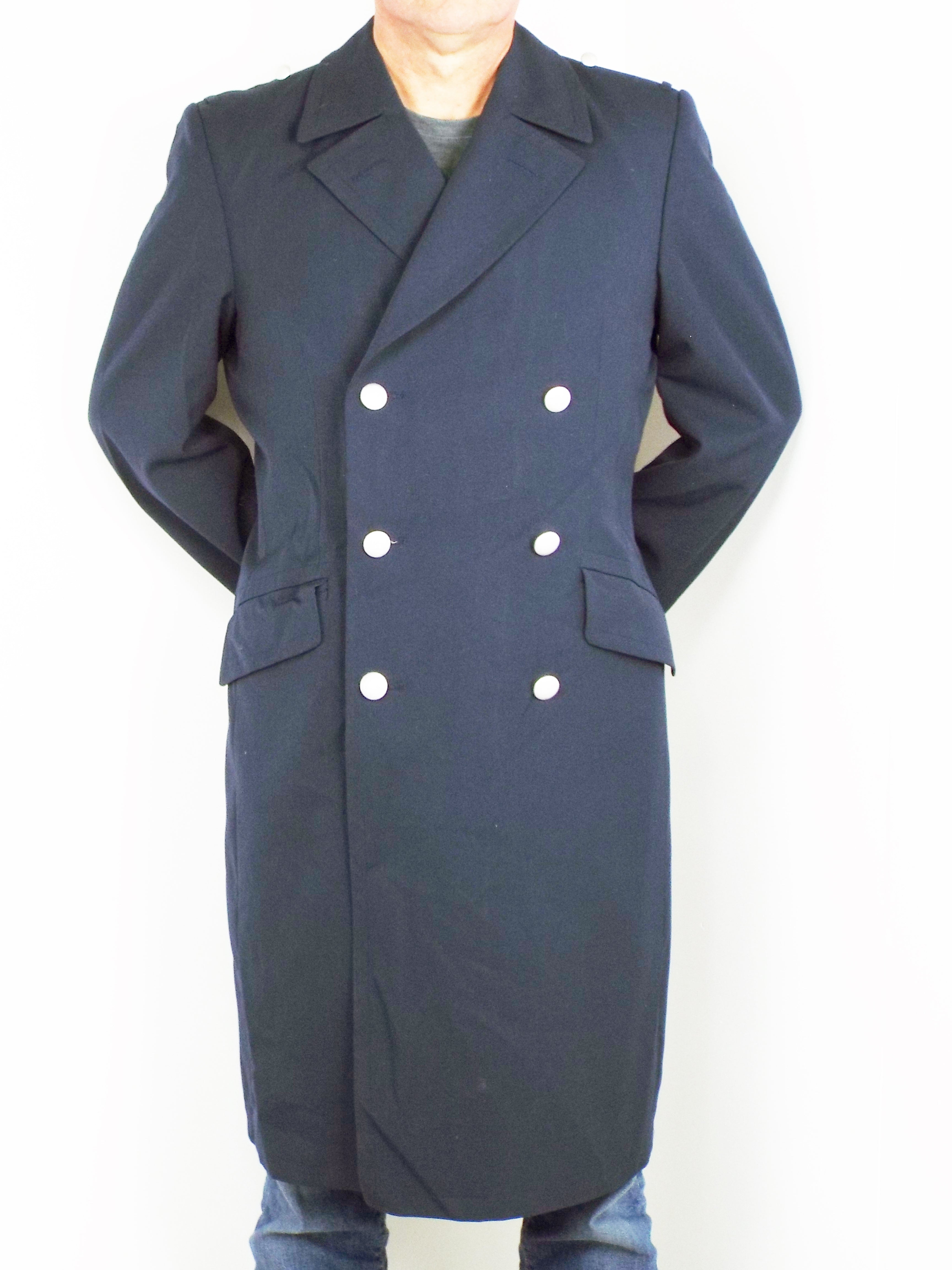 Front view of a dark blue German Navy trench coat in Grade 1 gabardine fabric, featuring a double-breasted design and silver stippled buttons.
