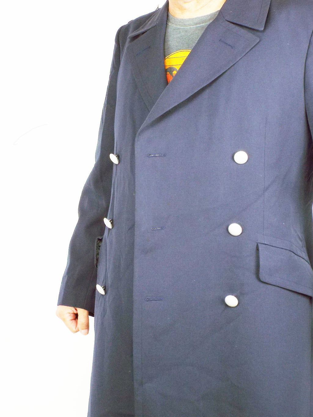 Close-up of the upper front of the dark blue German Navy trench coat, displaying the classic notched lapels and formal double-breasted silver button arrangement.