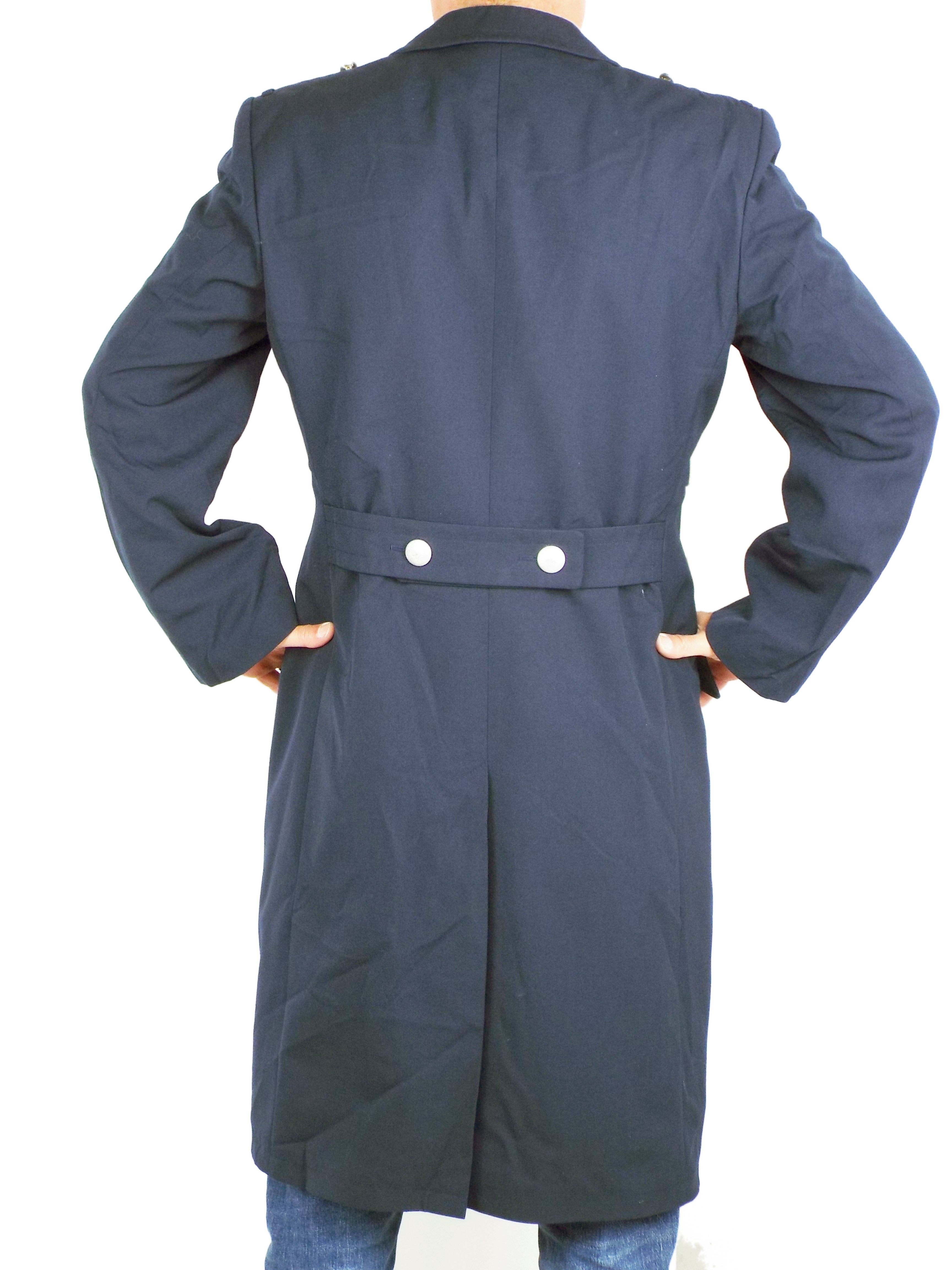 Rear view of the German Navy trench coat, showcasing the fitted cut, back half-belt with two silver buttons, and a central vent.