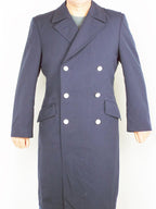 Full-length front view of the German Navy trench coat worn closed, displaying the high-quality dark blue gabardine material and sharp silhouette.