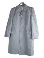 German army surplus grey trench coat for men, featuring a smart collar and single-breasted hidden button front closure.