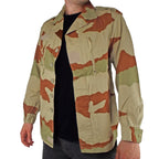 Three-quarter angle of the French Army CCE desert camo F2 jacket showing the button-front closure and classic military collar design.