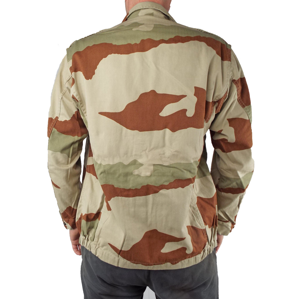 Rear view of the genuine French Army F2 jacket in desert camo, displaying the consistent CCE pattern and structured fit with an elasticated hem.