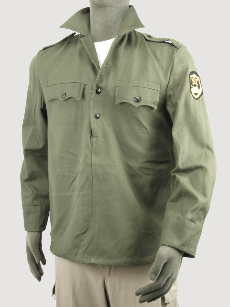 Front view of a Bulgarian military fatigue shirt on a mannequin, featuring shoulder epaulettes and a sleeve patch.