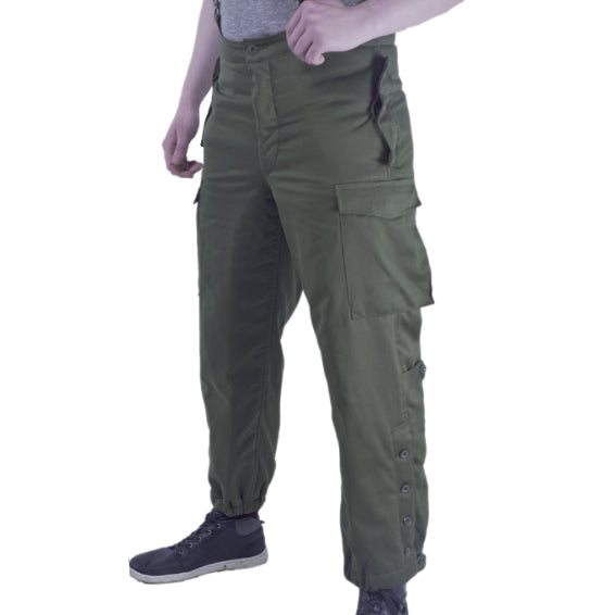 Side profile view of Austrian Army thermal combat trousers in RAL 7013 grey-green, showing side buttoned leg cuffs and cargo pockets.