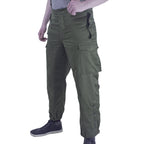 Side profile view of Austrian Army thermal combat trousers in RAL 7013 grey-green, showing side buttoned leg cuffs and cargo pockets.