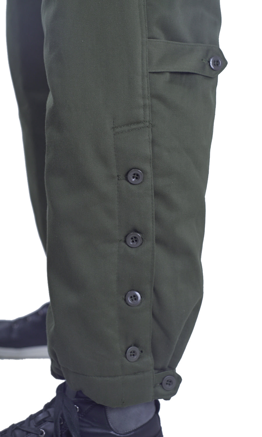 Close-up detail of Austrian Army thermal combat trousers lower leg, highlighting the heavy-duty buttoned cuff system for quick access over boots.