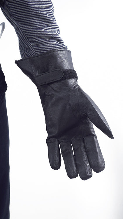 Palm side view of French military black leather glove showing the velcro wrist closure for a secure fit.