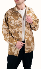 Model wearing a British Desert Combat Shirt in two-tone DPM camouflage with Canadian-style buttons and chest pockets.