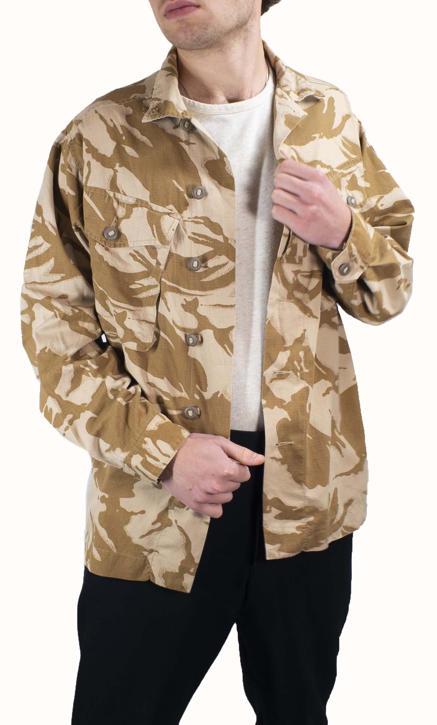 Model wearing a British Desert Combat Shirt in two-tone DPM camouflage with Canadian-style buttons and chest pockets.