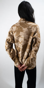 Rear view of the original British Army desert combat shirt illustrating the loose-cut design for better airflow.