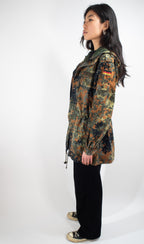 Side profile of the Bundeswehr Feldparka highlighting the sleeve pocket detail and German flag shoulder patch.