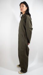 Side profile of the olive drab Dutch Army mechanic coveralls, showing the durable construction and utility pocket placement.