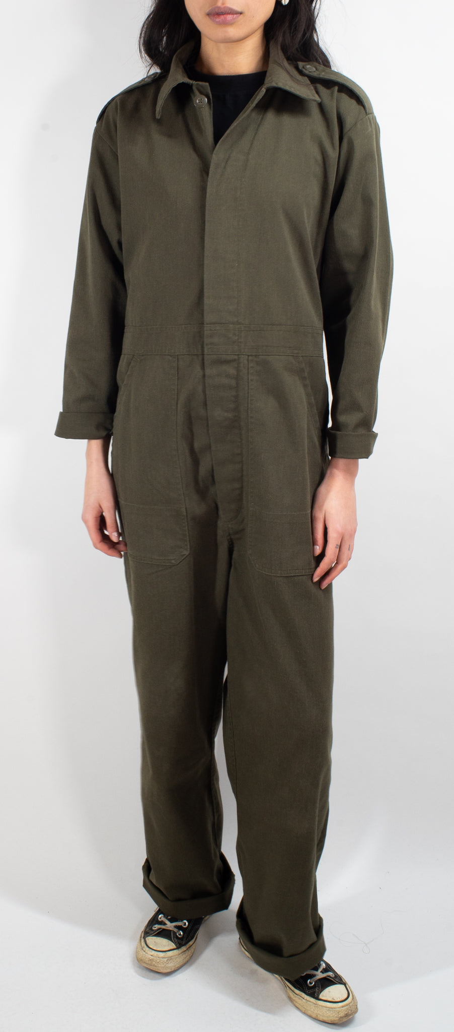 Front view of olive drab Dutch mechanic coveralls worn by a model, showcasing the practical button placket design.