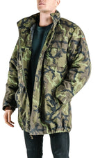 Side profile of the Czech Army M95 parka, highlighting the functional waist hand-warmer pockets and rugged camouflage construction.