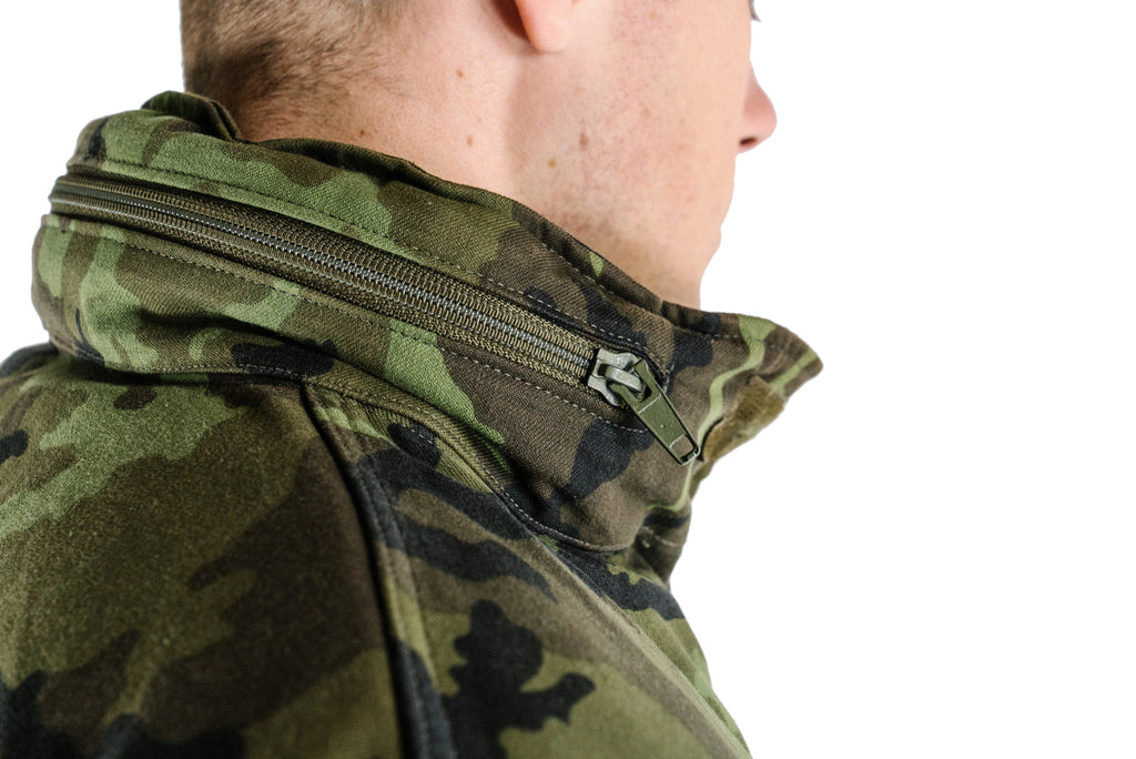 Detailed view of the collar area on a Czech Army M95 parka, showing the integrated zipper compartment for the concealed hood.