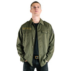 A model wearing the authentic Austrian army olive combat shirt, showcasing the shirt's fit, button-down front, and rugged material.