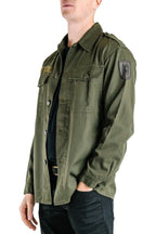 Side profile of the Austrian army olive combat shirt showing the embroidered military insignia on the sleeve and heavy cotton blend texture.