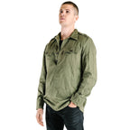 Man wearing a Bulgarian heavy duty olive green fatigue shirt with metal buttons and a three-button neckline.