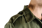 Close-up of the shoulder epaulette on an authentic Bulgarian olive green military fatigue shirt.