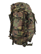Angled side view of the 60 litre military surplus backpack showing external webbing and compression straps for securing gear.