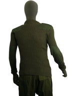 Rear view of the British Army Woolly Pully jumper on a mannequin, showing the full-length heavy ribbed knit construction and shoulder reinforcements.