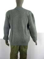 Rear view of a grey Swiss military wool sweater on a mannequin, showcasing the thick, warm knit construction and classic fit.