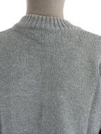 Macro detail of the high-quality grey wool knit and rib-knit neckline of the Swiss Army sweater.