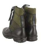 Rear view showing a pair of authentic German jungle boots with reinforced flexible ankle sections and sturdy black soles.