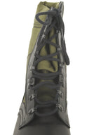 Front-on view of a German jungle boot showcasing the secure black lace-up system with durable closed loop metal eyelets.