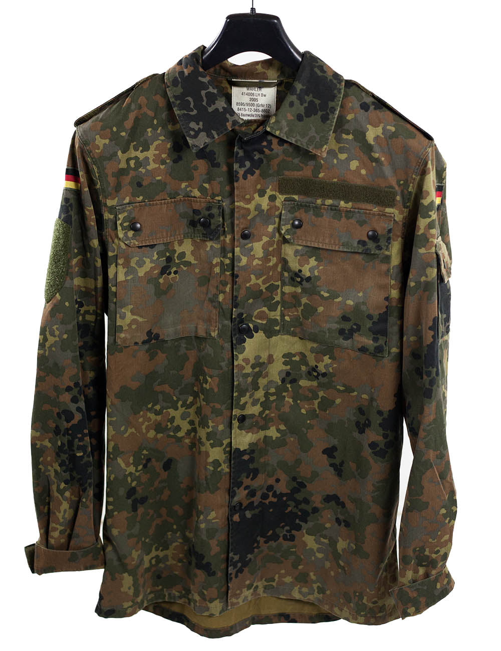 Genuine German Army Flecktarn shirt on hanger, displaying official Bundeswehr internal manufacturing labels, shoulder epaulettes, and flag patches.