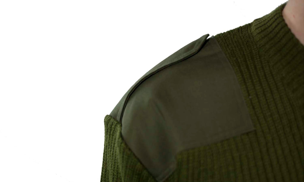 Close-up detail of the reinforced fabric shoulder epaulette on an olive green Italian Army military surplus wool jumper.