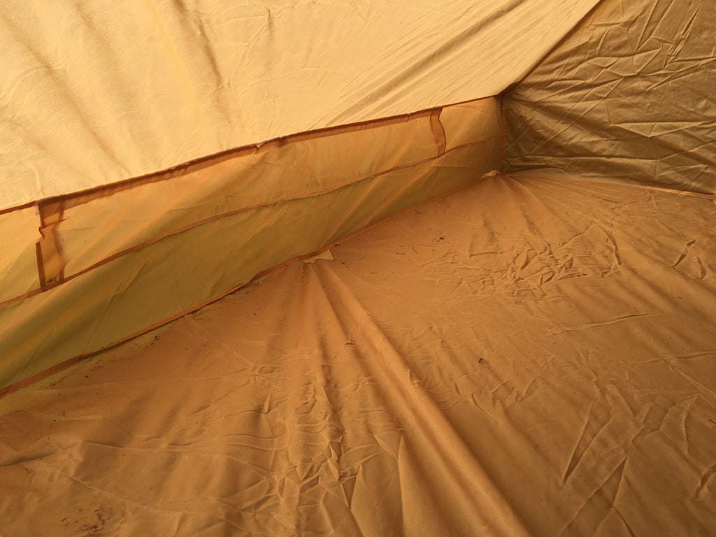 Interior view looking toward the rear wall of the coyote nylon tent.