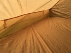 Interior view looking toward the rear wall of the coyote nylon tent.