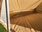 View of the open side wall ventilation mesh panel with the Velcro-secured flap folded down.