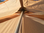 Top interior view of the tent, showing the apex where the modular pole supports the structure.