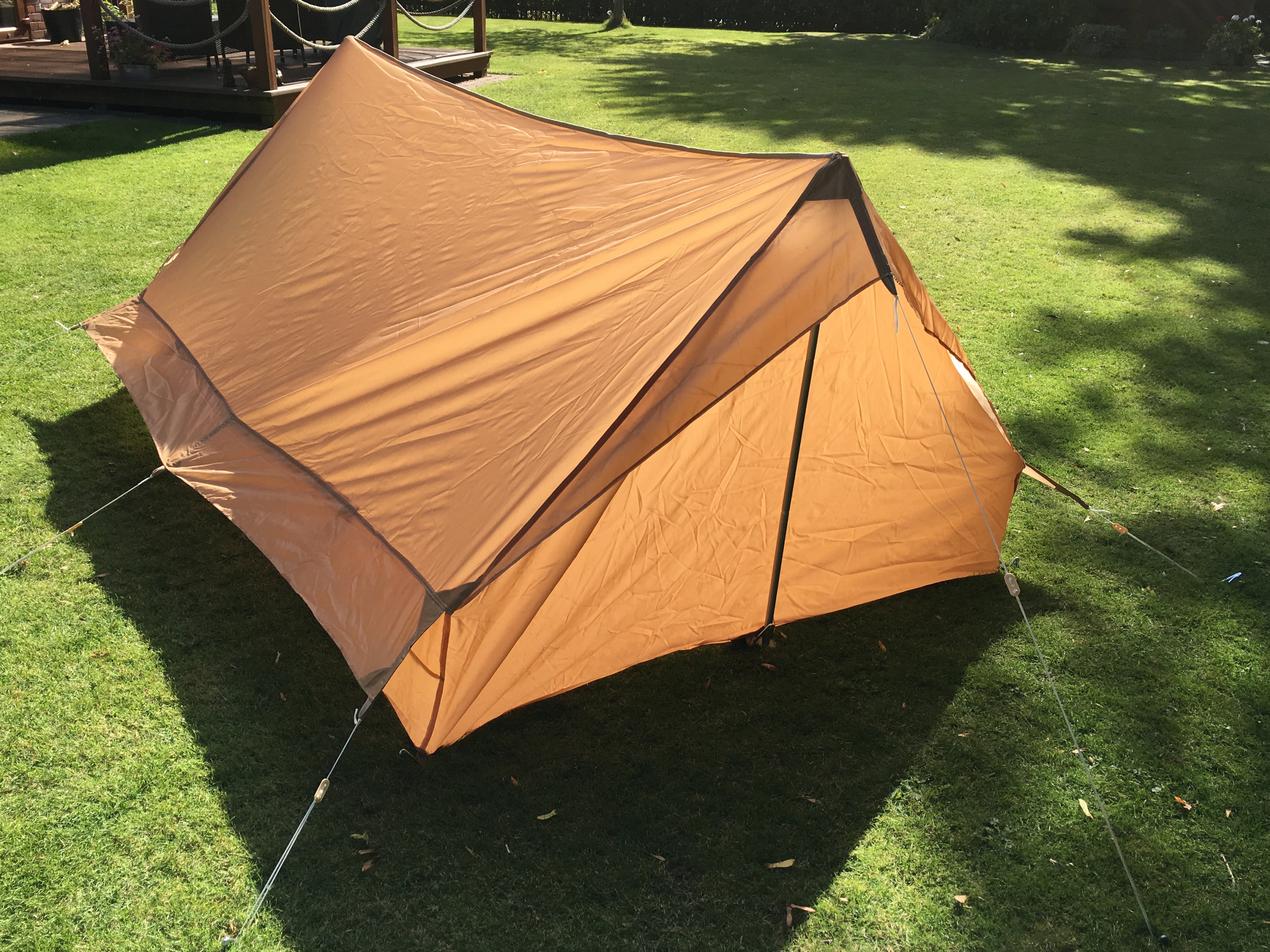 Overhead view of the tent structure, highlighting the desert coyote polyester-nylon fabric.