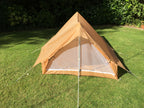 Front entrance view of the desert nylon tent with fly-screen mesh panel visible.