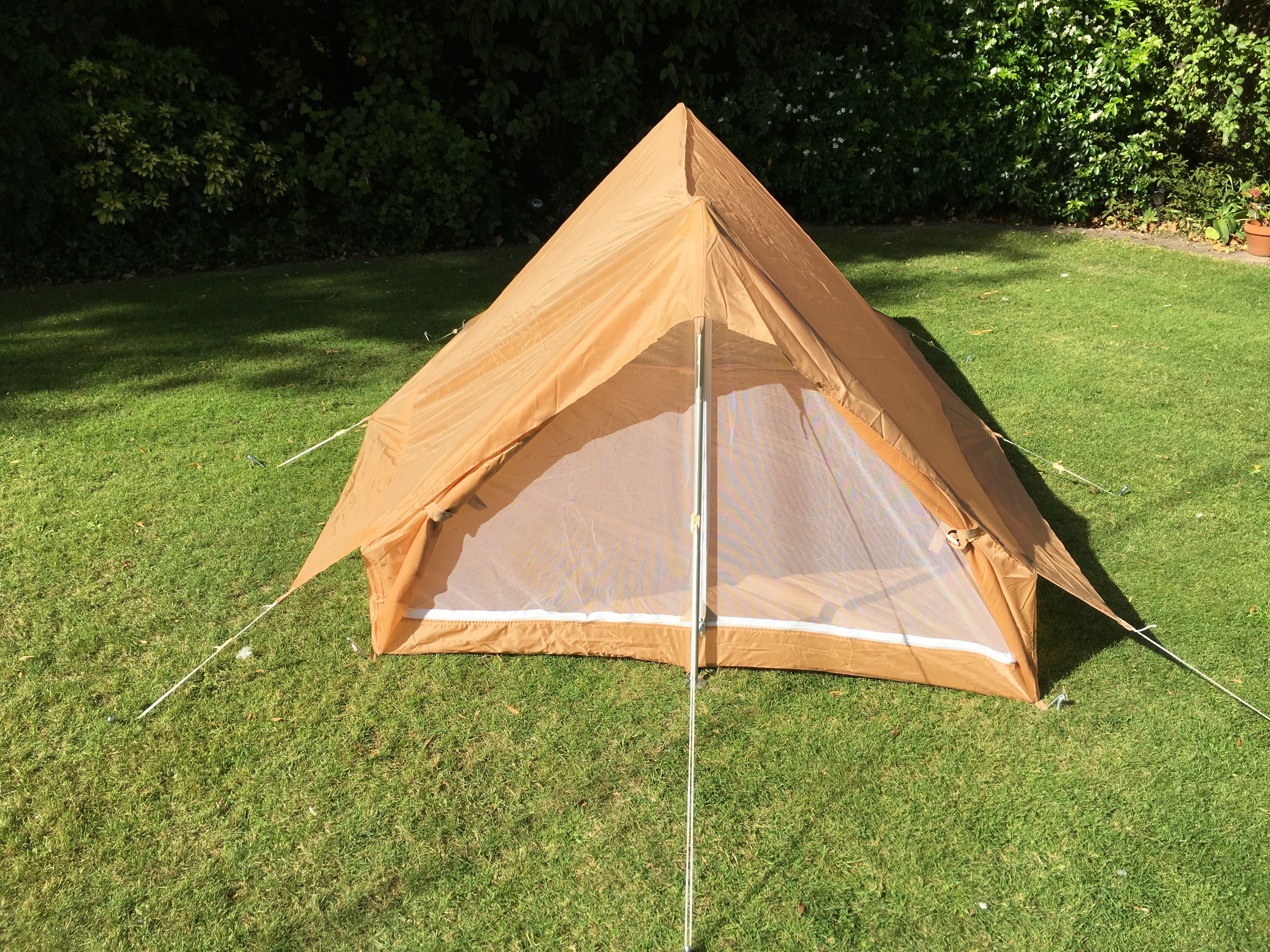 Front entrance view of the desert nylon tent with fly-screen mesh panel visible.