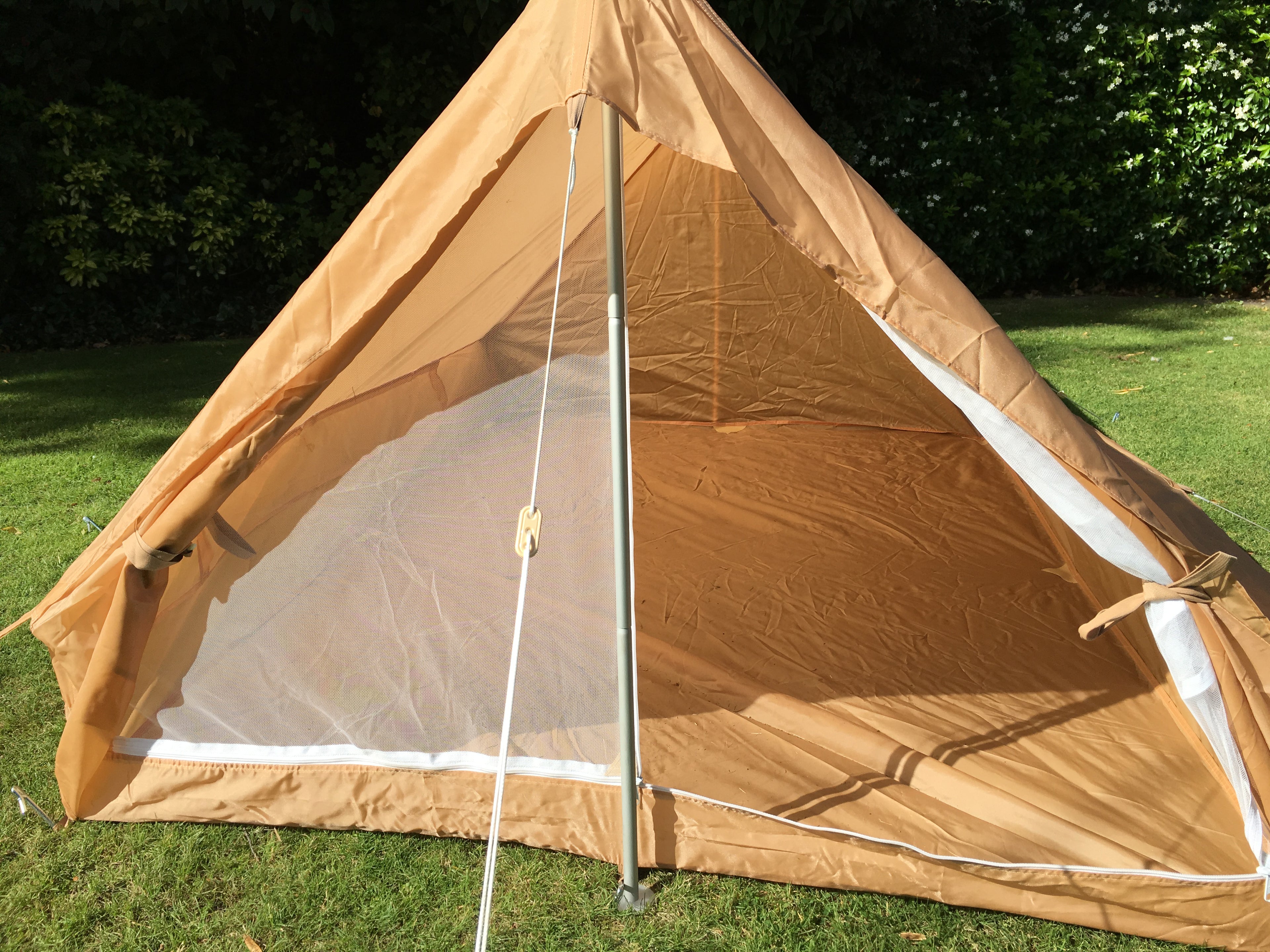 View looking inside the two-man tent, featuring the durable floor and central pole support.