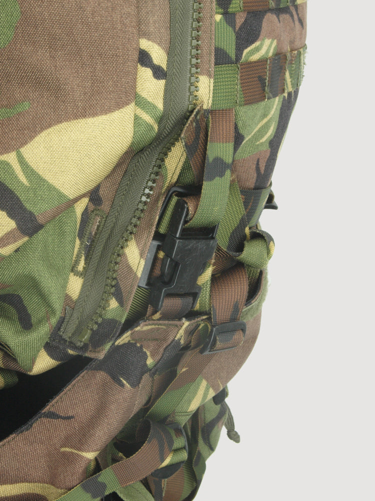 Detail view of a side zipper and heavy-duty buckle closure on the waterproof woodland camo military bag.