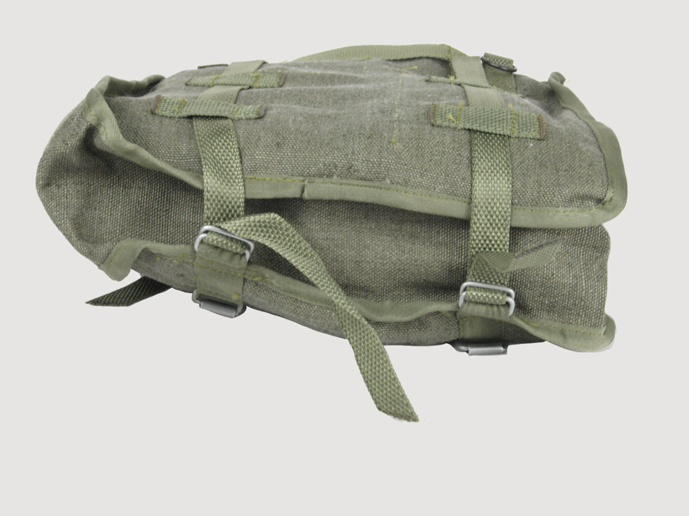 Side profile view of Polish Army canvas shoulder bag displaying sturdy gusset construction and metal buckles for securing contents.